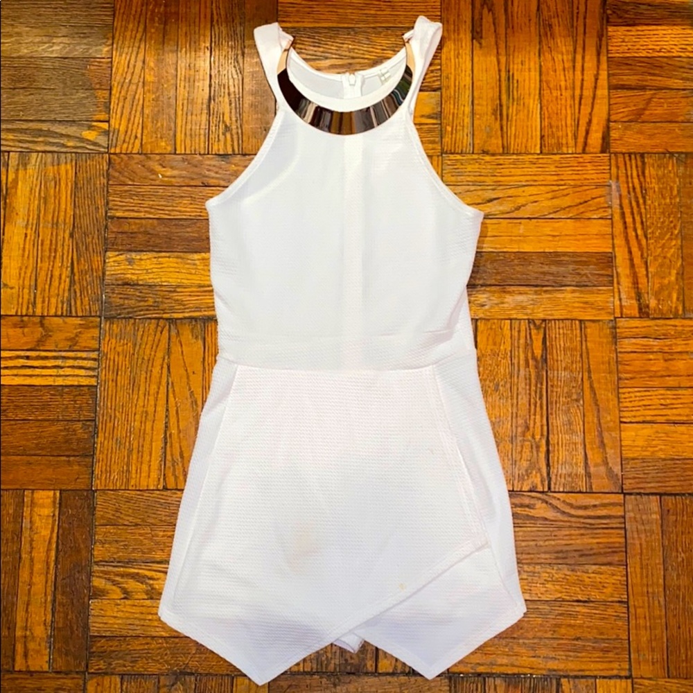 White romper with attached gold necklace